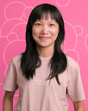 A black & white portrait of Stile team member Emily Cheng smiling at the camera