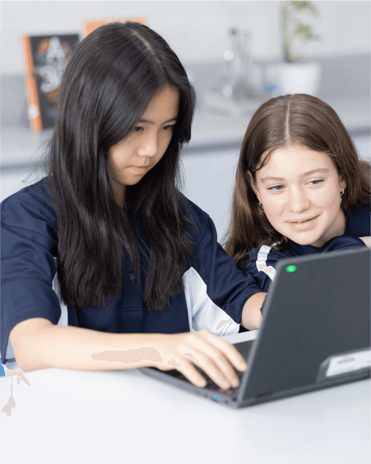 Two girls in a science classroom completing mindfullness colouring.