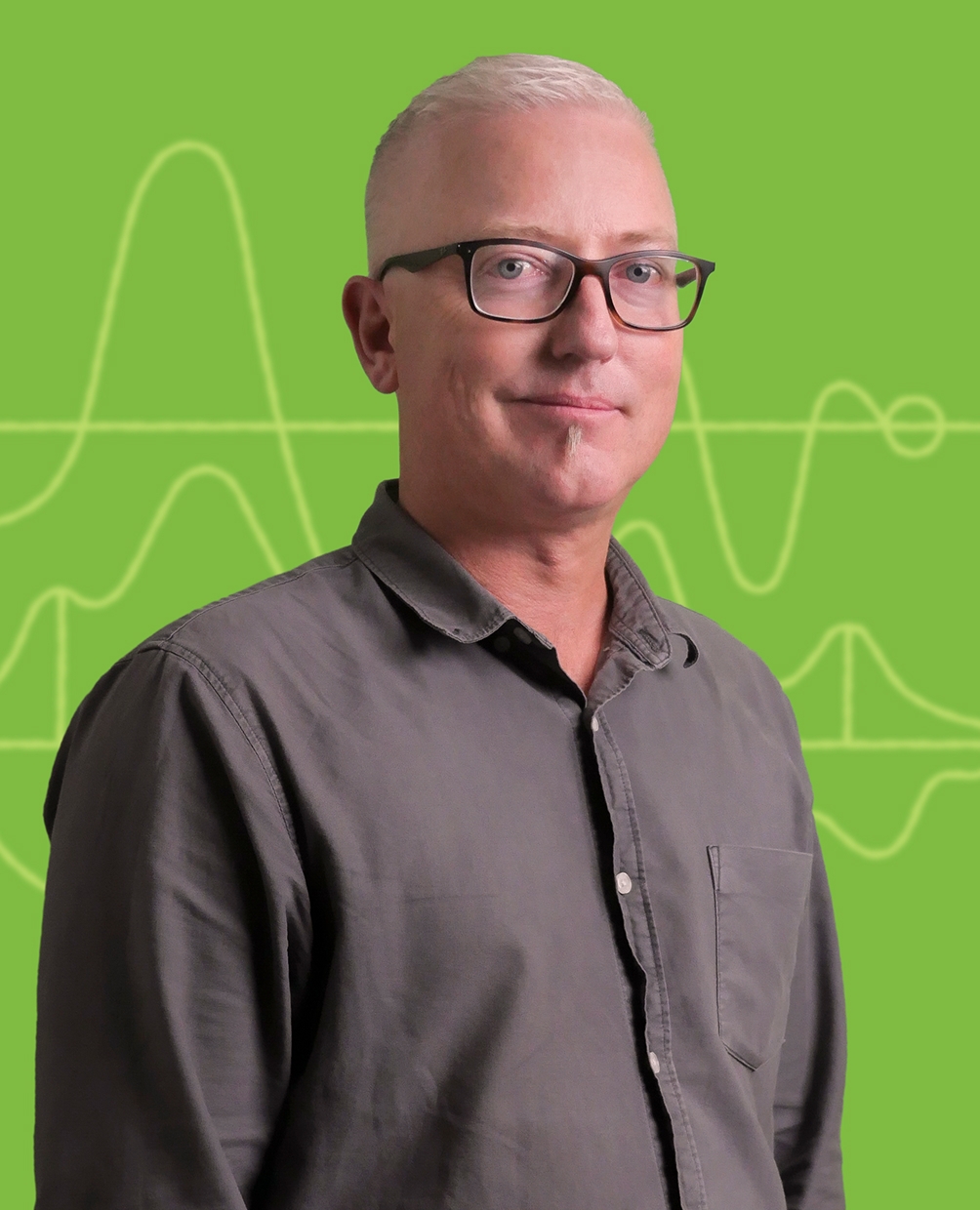Stile team member Steve Dornan against a green science-themed background.