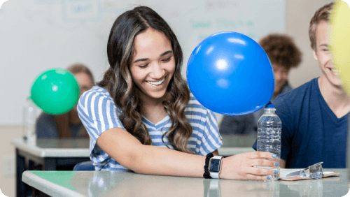 A student performing an experiment involving a balloon