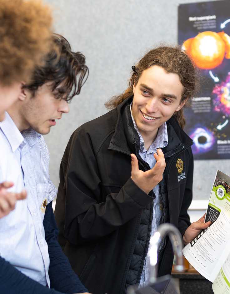 Students collaborating in a hands-on, off-device science activity