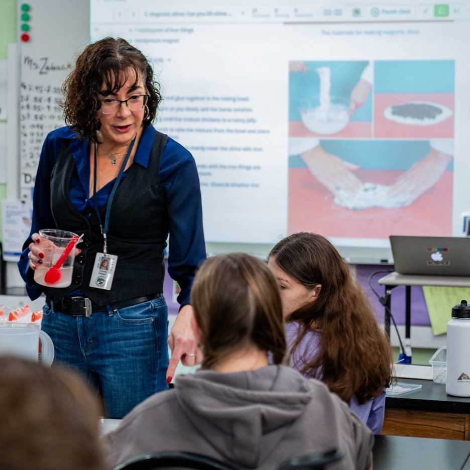 A teacher explicitly teaching a science concept to students