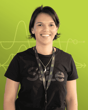 A black & white portrait of Stile team member Alexandra Russell smiling at the camera