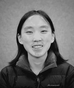 A black & white portrait of Stile team member Karleen Han smiling at the camera