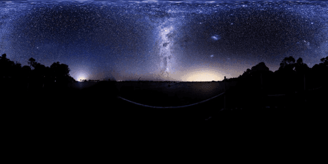 The night sky, with the landscape silhouetted at the bottom