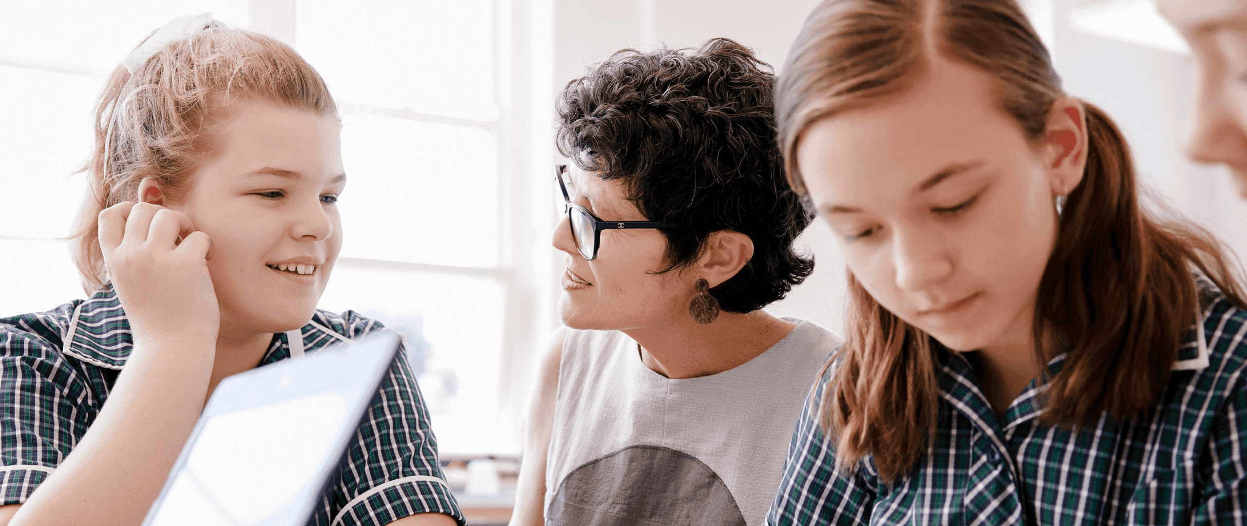 A teacher and students discussing real-world science together